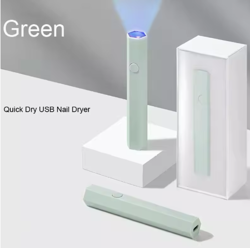 Green quick dry USB nail dryer with packaging on a light gray background